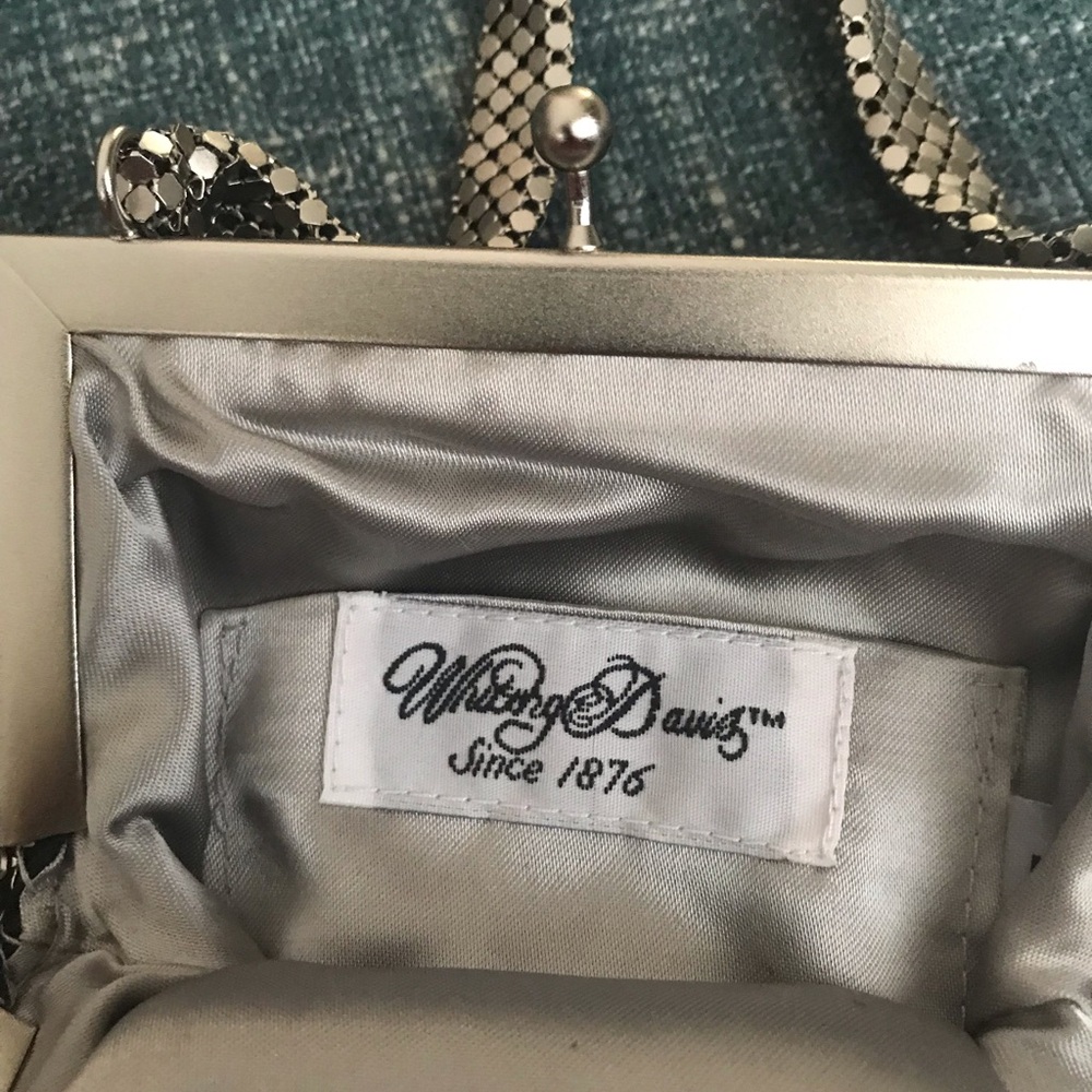 Woman’s silver Whiting and Davis evening bag.